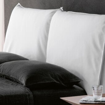 Distinguished Cattelan Italia Lukas bed with soft leather upholstery and chromed steel feet in a clean white finish