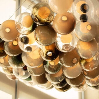 Distinguished Bocci 28 Cluster suspension lamp with clustered clear glass spheres and milk white interior lamp holder cavities