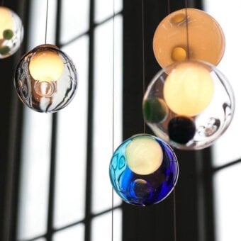 Exceptional Bocci 28 Random suspension lamp crafted in clear glass with milk white interiors and suspended blue green orbs