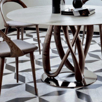 Elegant Porada Infinity table with light-colored top and Canaletto walnut base crafted with polished metal accents