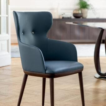 Sophisticated Porada Andy chair with Canaletta Walnut frame and deep blue-gray leather upholstery crafted in Italy