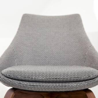 Exceptional Porada Penelope chair with woven gray textile upholstery and Canaletto walnut frame built with a patterned seat cushion