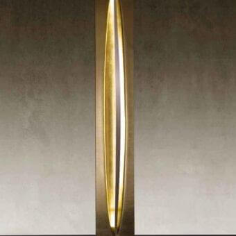 Lavish Reflex Terra floor lamp with gracefully curved form built in extra clear glass and striking gold leaf finish