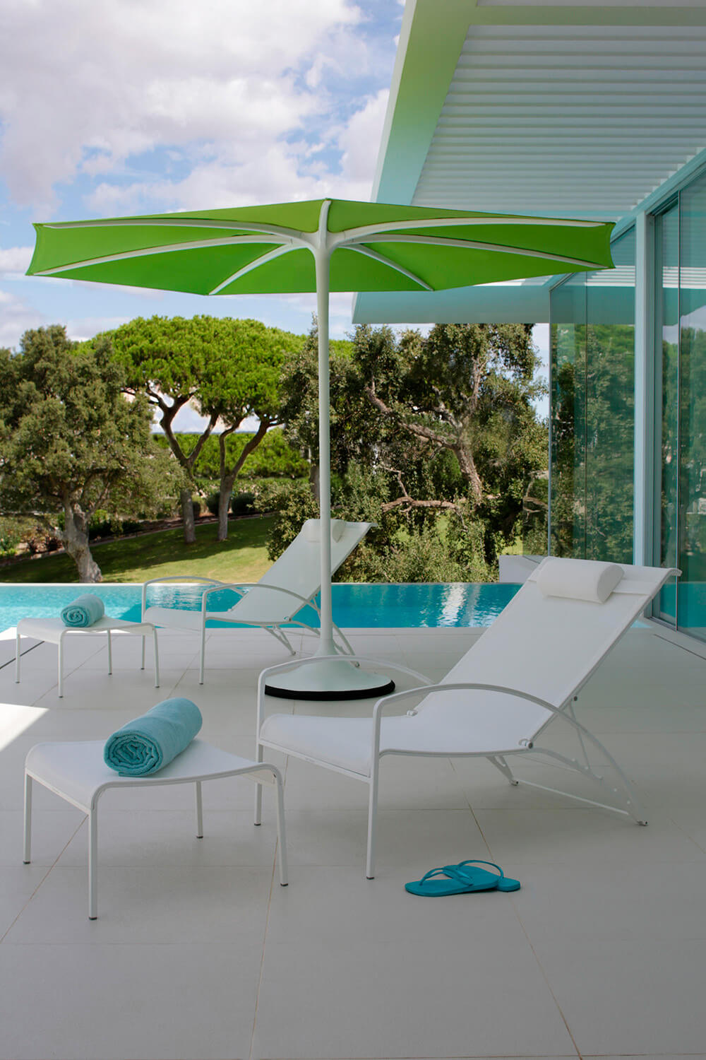 Sophisticated Royal Botania QT Lounger chair with white Batyline seat in brushed electro polished stainless steel