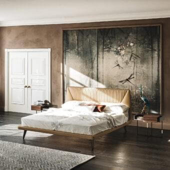 Sophisticated Cattelan Italia Amadeus bed with light tan leathertex upholstery and dark satin-finished wood frame built with angled, matt bronze legs