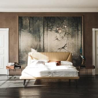 Refined Cattelan Italia Amadeus bed with light tan textile upholstery and graphite embossed lacquered steel feet