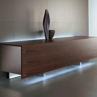 Elegant Acerbis Ludwig sideboard with reddish-brown wood, white lacquered interior and illuminated metallic side panels