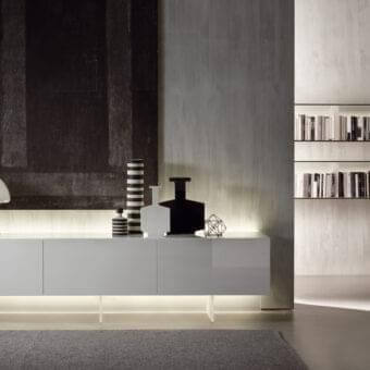 Innovative Acerbis N.C. sideboard with glossy white finish and transparent methacrylate base creating integrated rear-lighting