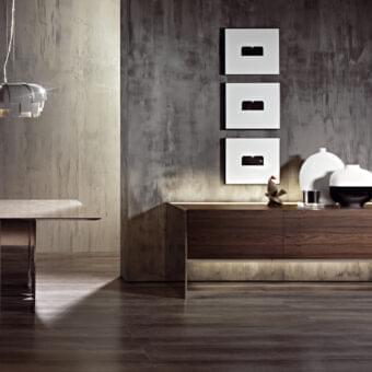 Distinguished Acerbis Steel sideboard with dark wood finish and mirror polished steel supporting a rear integrated lighting system