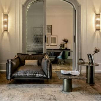 Exceptional Arketipo Auto-Reverse lounge chair upholstered in deep brown leather with a smooth, textured finish and lighter fabric seat cushion