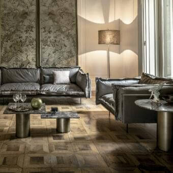 Exceptional Arketipo Auto-Reverse lounge chair with dark grey leather upholstery and lighter textile flounces secured with bold zippers