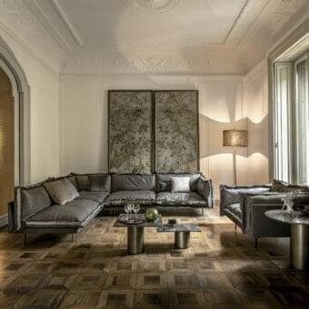 Distinguished Arketipo Auto-Reverse sectional with muted gray two-sided leather and fabric upholstery plus minimal metal feet