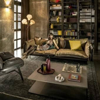 Exceptional Arketipo Auto-Reverse sofa with golden brown distressed leather and a thin metal base offering a contemporary silhouette
