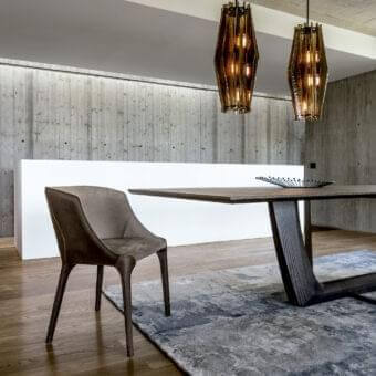 Distinguished Arketipo Goldie chair with textured matte textile upholstery and dark-toned wood frame