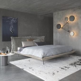 Elegant Arketipo Iride wall lamp with geometric circular lights and micaceous brown metal structure in titanium finish