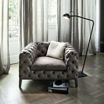 Exceptional Arketipo Windsor lounge chair in dark velvet with diamond quilting and button tufting, built with a discreet wood frame
