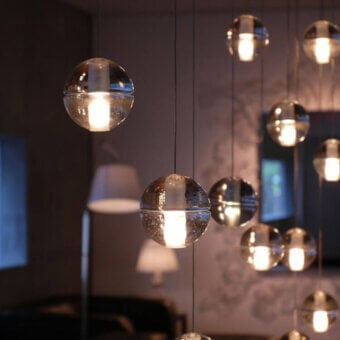 Distinguished Bocci 14 Random Suspension lamp with articulated cast glass spheres and clear-to-metallic silver finish delivering diffused light