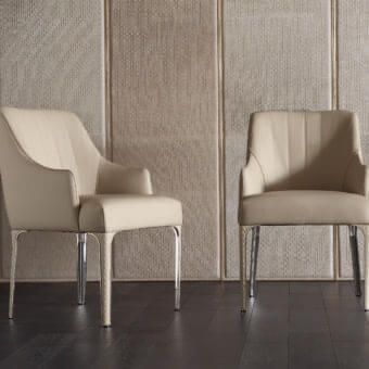 Distinguished Rugiano Arianna armchair upholstered in light beige textile with smooth finish and refined steel legs with matelassé embroidery