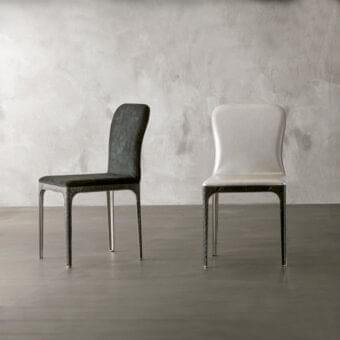 Exclusive Rugiano Viviane chair with curved back and high-end steel legs upholstered in light textile