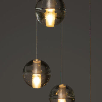 Distinguished Bocci 14 Random suspension lamp with cast glass spheres and a textured dark tinted surface