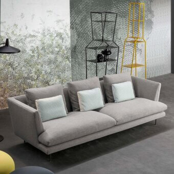 Sophisticated Bonaldo Lars sofa with geometric silhouette and wide cushions in gray textile with matte finish