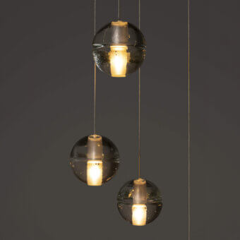 Captivating Bocci 14 Random suspension lamp with articulated cast glass sphere and frosted cylindrical void in translucent tones