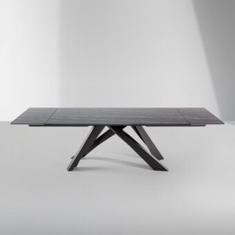 Elegant Bonaldo Big extendable table with dark ceramic top and laser-cut steel legs crafted in a uniform tone