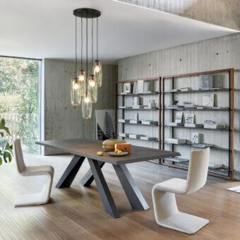 Exceptional Bonaldo Big table with hand-spatulated clay top and dark gray stone-like finish, showcasing intersecting angled legs