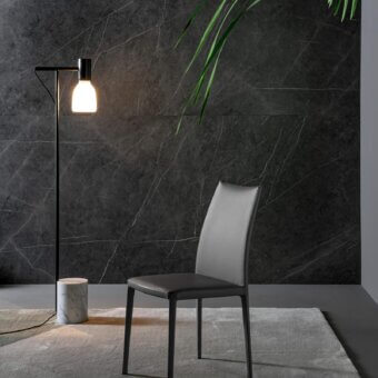 Elegant Bonaldo Kayla up chair showcases light gray fabric upholstery with a matte dark metal frame and legs