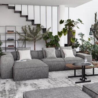 Refined Bonaldo Peanut B sofa with enveloping medium gray textured fabric and subtly elevated anthracite gray painted wood feet