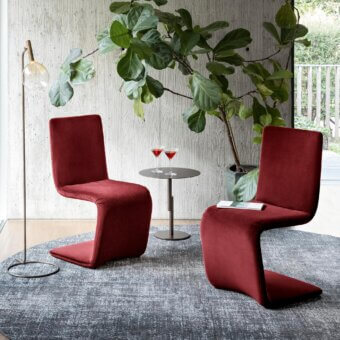 Distinguished Bonaldo Venere chair upholstered in deep red textile with a matte finish and cantilevered form