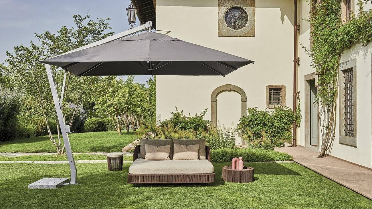 Distinguished Varaschin Copacabana umbrella with a square gray matte synthetic textile canopy and white aluminum frame