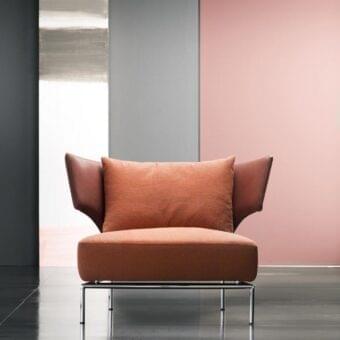 Exceptional Erba Abbraccio lounge chair with light terracotta textile upholstery and bright chrome metal base