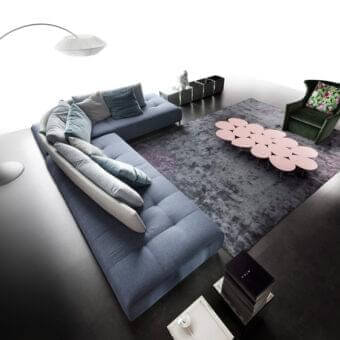 Distinguished Erba Conversation sectional with plush tufted cushions upholstered in refined blue-grey textile and sleek metal base