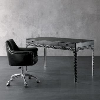 Distinguished Rugiano Coline desk with black leather cover, matelassé embroidery and sleek metallic legs offering a polished aesthetic