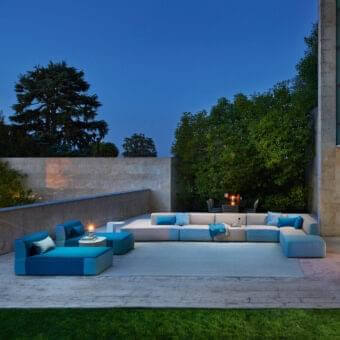 Sophisticated Varaschin Belt sectional with light beige textile and contrasting blue accents in solid okumé wood