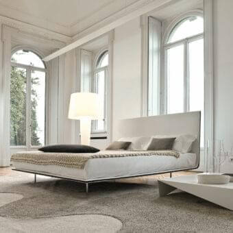 Elegant Bonaldo Thin bed with light-colored fabric upholstery and a smooth matte finish built with a fabric profile detail