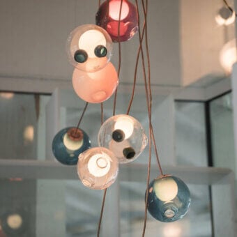 Superior Bocci 28 Copper suspension lamp crafted with hand-blown clear and milk white glass spheres with natural copper cords and patina finish