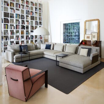 Distinguished Swan Italia Hemingway sectional in light gray woven fabric with dark wood supports and contrasting pillows