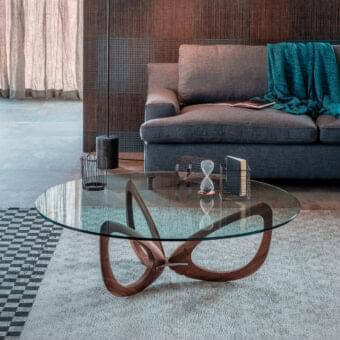 Distinguished Cattelan Italia Helix coffee table with wide circular glass top and warm brown solid wood propeller-inspired base