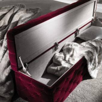 Lavish DV Home Collection Avery trunk upholstered in quilted, deep burgundy textile with multilayer structure crafted with high-density foam polyurethane