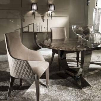 Distinguished DV Home Collection Byron armchair with neutral beige fabric upholstery and sleek stainless steel legs
