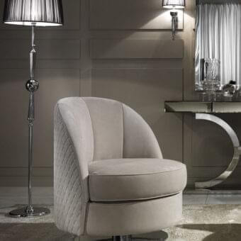 Distinguished DV Home Collection Charlotte lounge chair with neutral beige quilted fabric and shining stainless steel circular base
