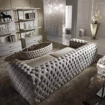 Sophisticated DV Home Collection Chelsea sofa with light gray soft-textured tufted fabric and solid wood structure