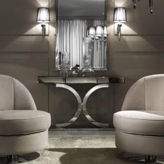 Elegant DV Home Collection Kent Plus console with bronze mirror and intersecting stainless steel curves
