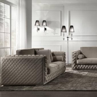 Lavish DV Home Collection sofa with taupe velvet upholstery, quilted detailing and a low chrome metal base