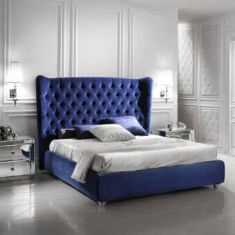 Lavish DV Home Collection Vogue bed with royal blue velvet upholstery and deeply button-tufted construction