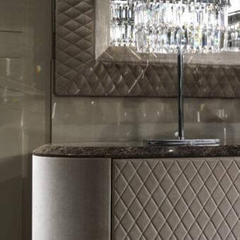 Distinguished DV Home Collection Vogue sideboard with quilted leather doors and dark stone-like countertop in shining lacquered MDF