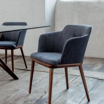 Exceptional Porada Celine armchair with Canaletto walnut wood frame and plush dark gray textile upholstery with satin finish