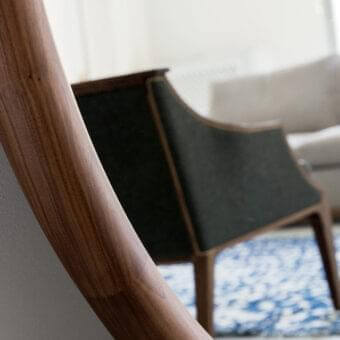 Superior Porada Giove mirror with tall narrow frame in solid Canaletto walnut exhibiting warm brown wood grain